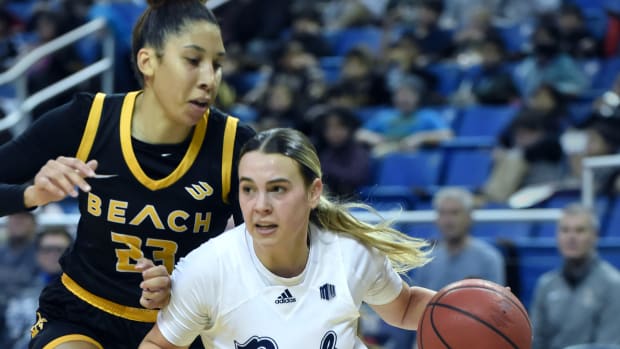 Nevada's Kaylee Borden drives past Long Beach State's Lauren Green during Thursday's game at Lawlor Events Center on Dec. 8, 2022. Nevada Womens Basketball 1